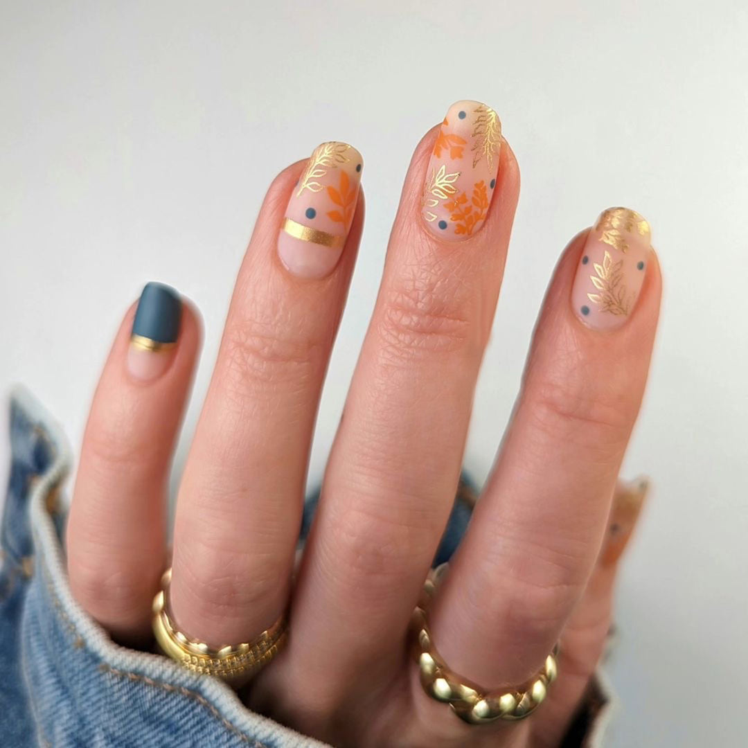 Artistic nail design with floral and golden accent Bowlift