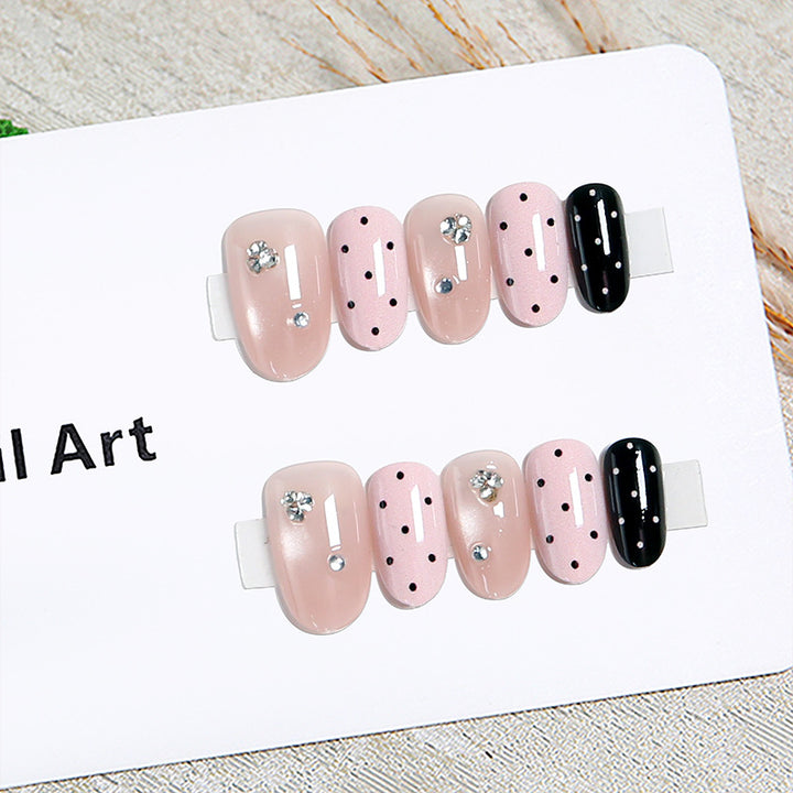 Acrylic nail set with glamorous rhinestone accents and modern dots Bowlift