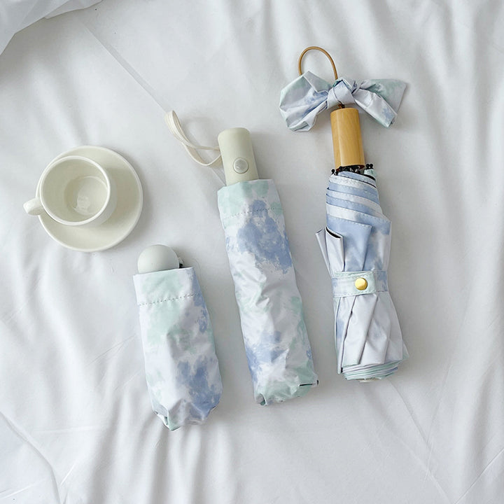 Ladies elegant folding umbrella with modern cloud pattern Bowlift