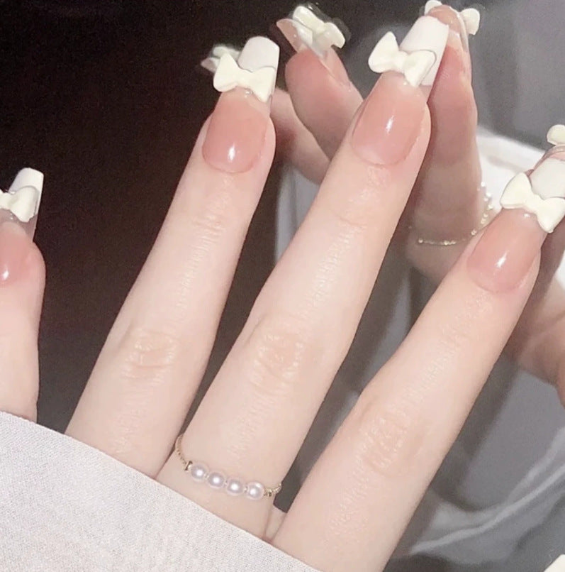 Elegant nail design with pearl embellishment Bowlift