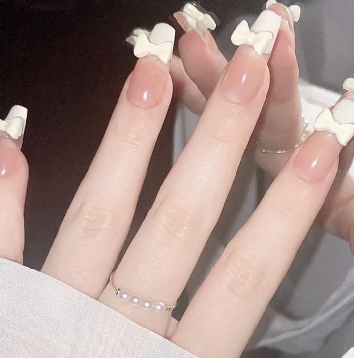 Elegant nail design with pearl embellishment Bowlift