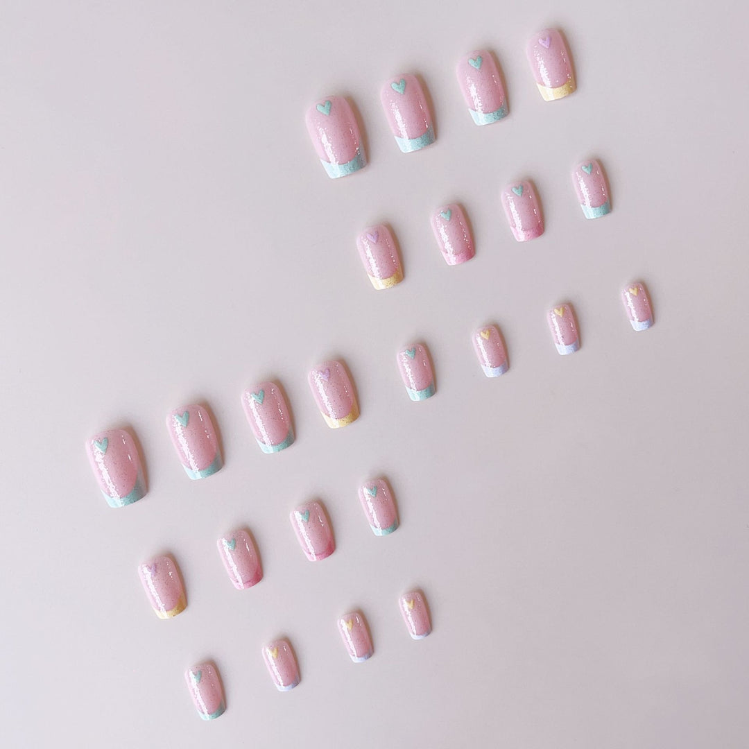 Artificial nail set with playful color gradients and heart motifs Bowlift