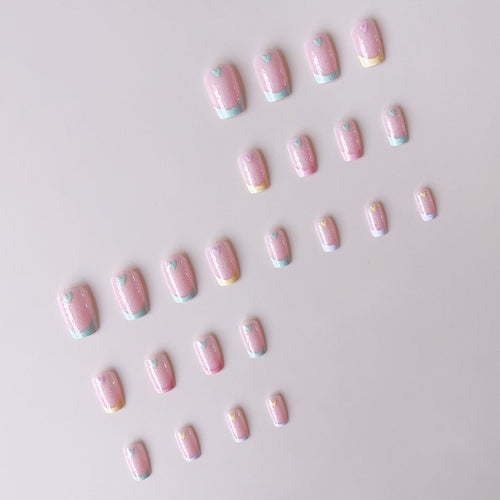 Artificial nail set with playful color gradients and heart motifs Bowlift