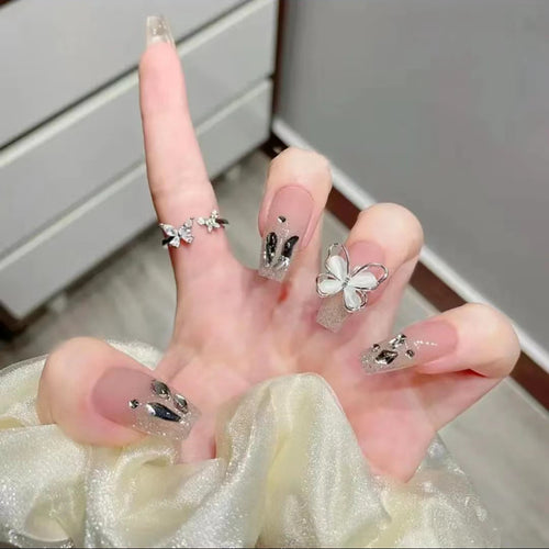 Artful Nail Art with Glitter and Butterfly Elements Bowlift