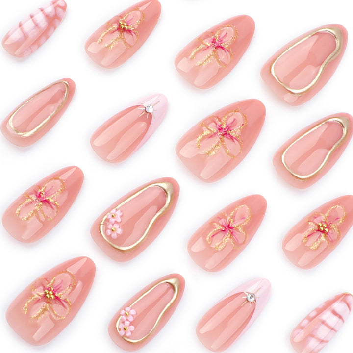 Artful nail design with glitter and floral accents Bowlift