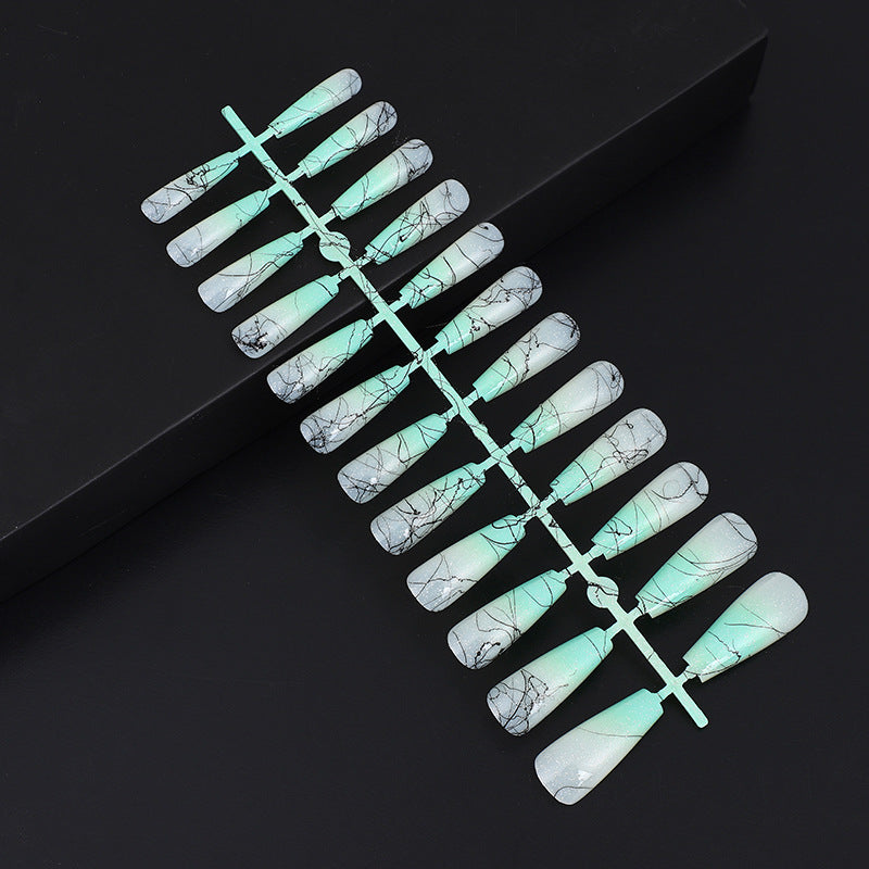 Artificial nails in modern ombre design with marbled accents Bowlift