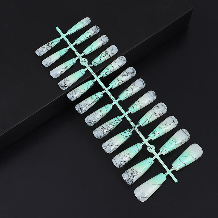 Artificial nails in modern ombre design with marbled accents Bowlift