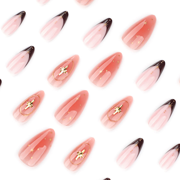 Artful stiletto nails with elegant gold embellishments Bowlift