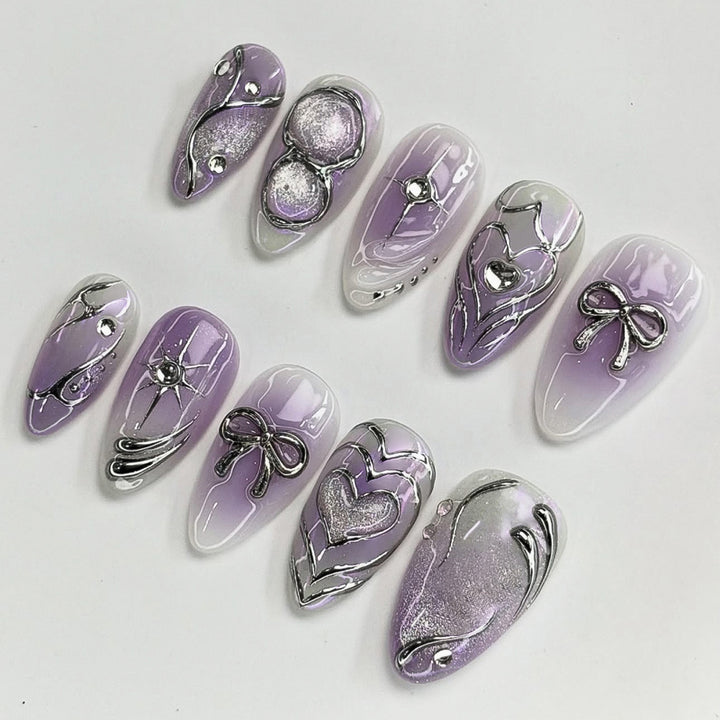 Artful Nail Art with Shiny Accents and Delicate Lilac Bowlift