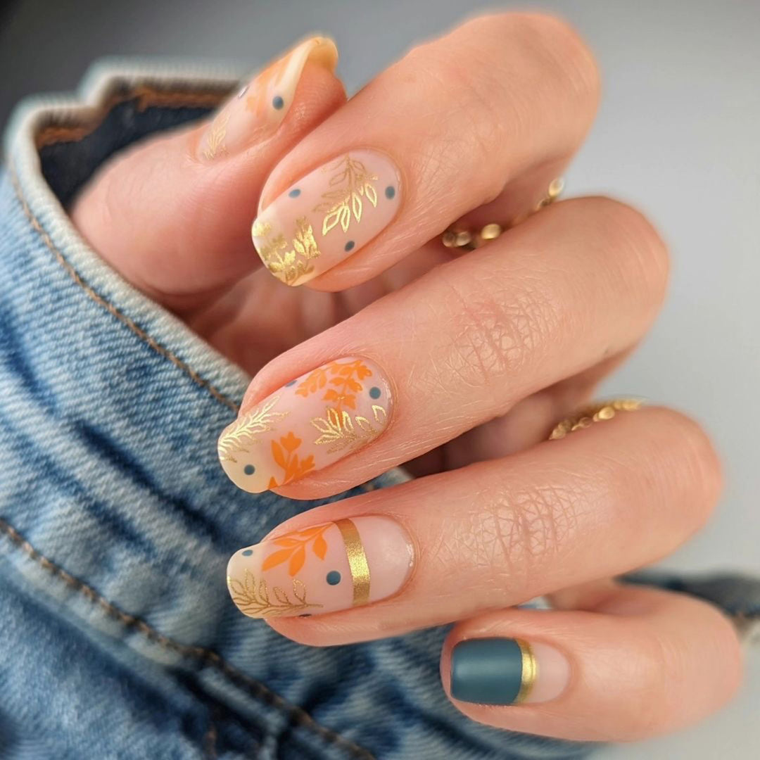 Artistic nail design with floral and golden accent Bowlift