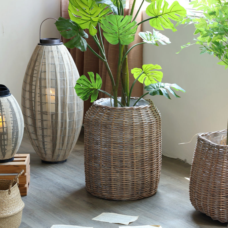 Stylish laundry basket made of braided natural material Bowlift