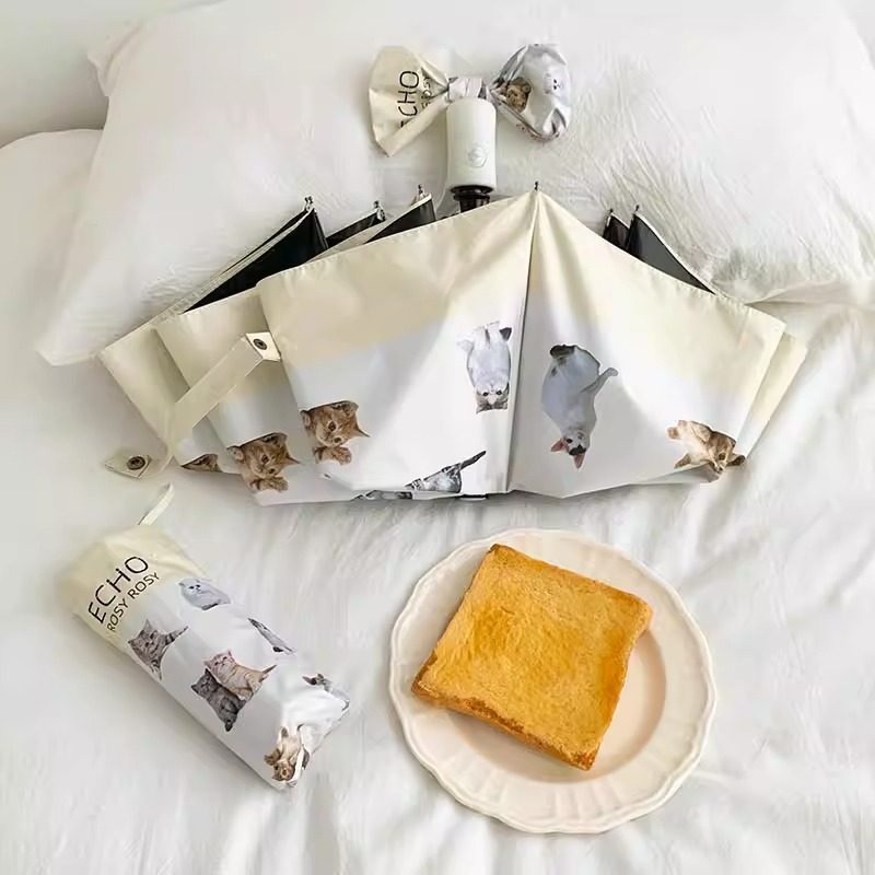 Ladies folding umbrella with playful animal design Bowlift