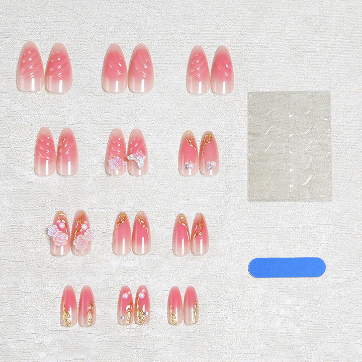 Artificial nail creation with floral 3D details and glitter accents Bowlift