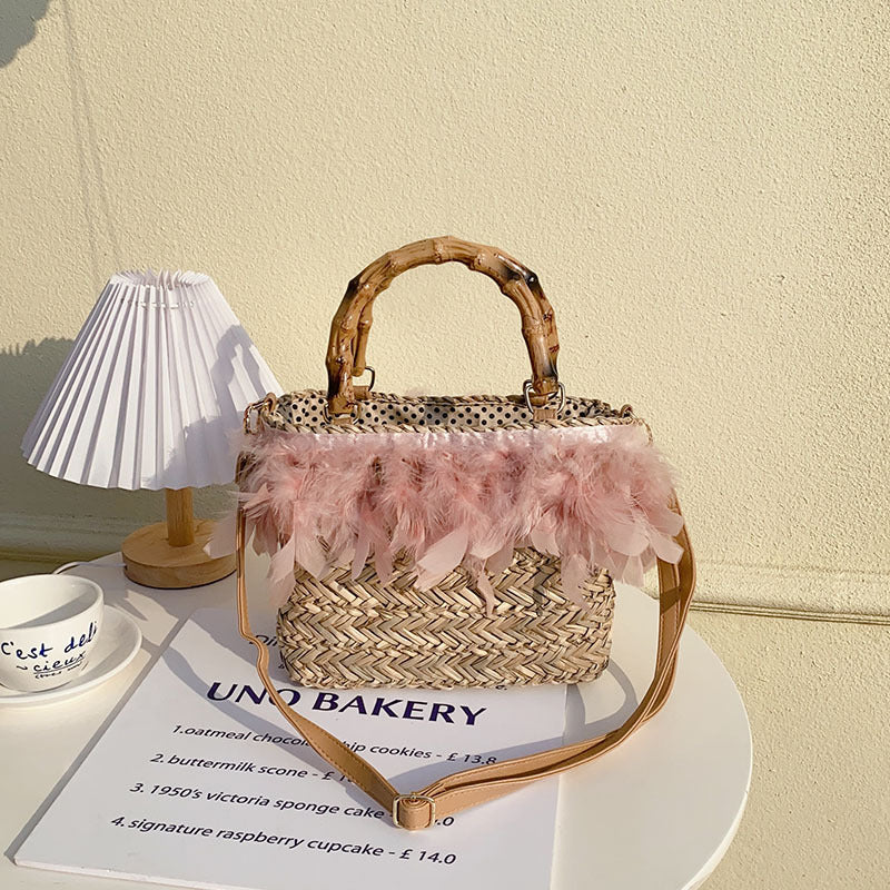 Elegant handbag with feathers and bamboo handles Bowlift