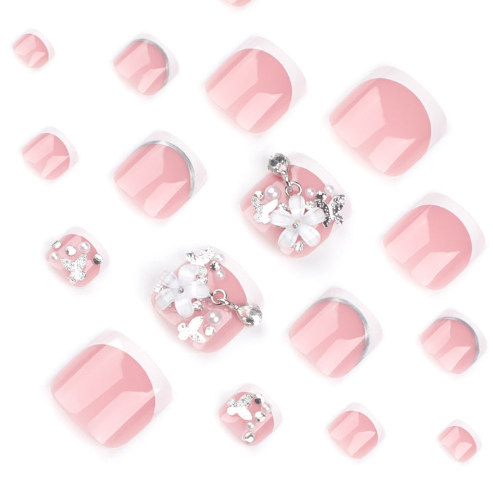 Artful toenail design with elegant flower and glitter accents Bowlift