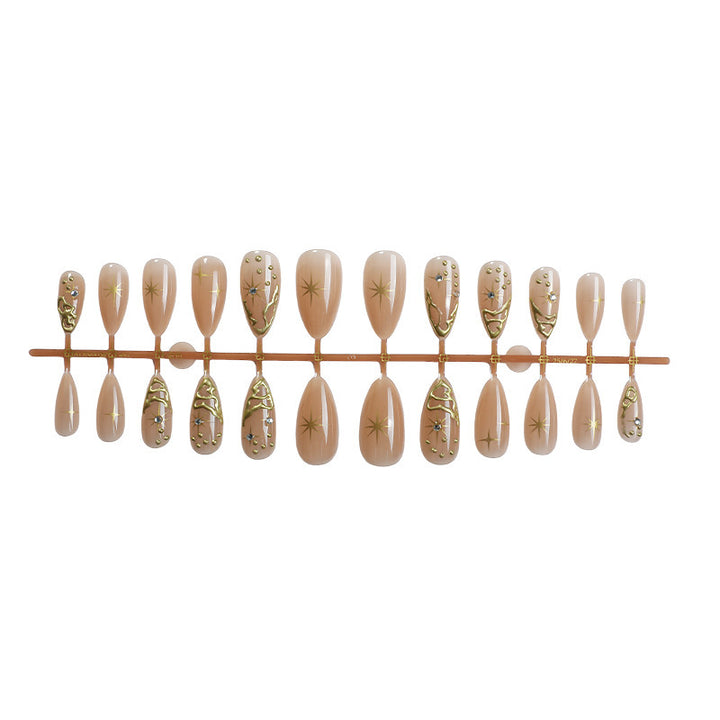 Creative nail set with elegant gold embellishments and sparkling accents Bowlift