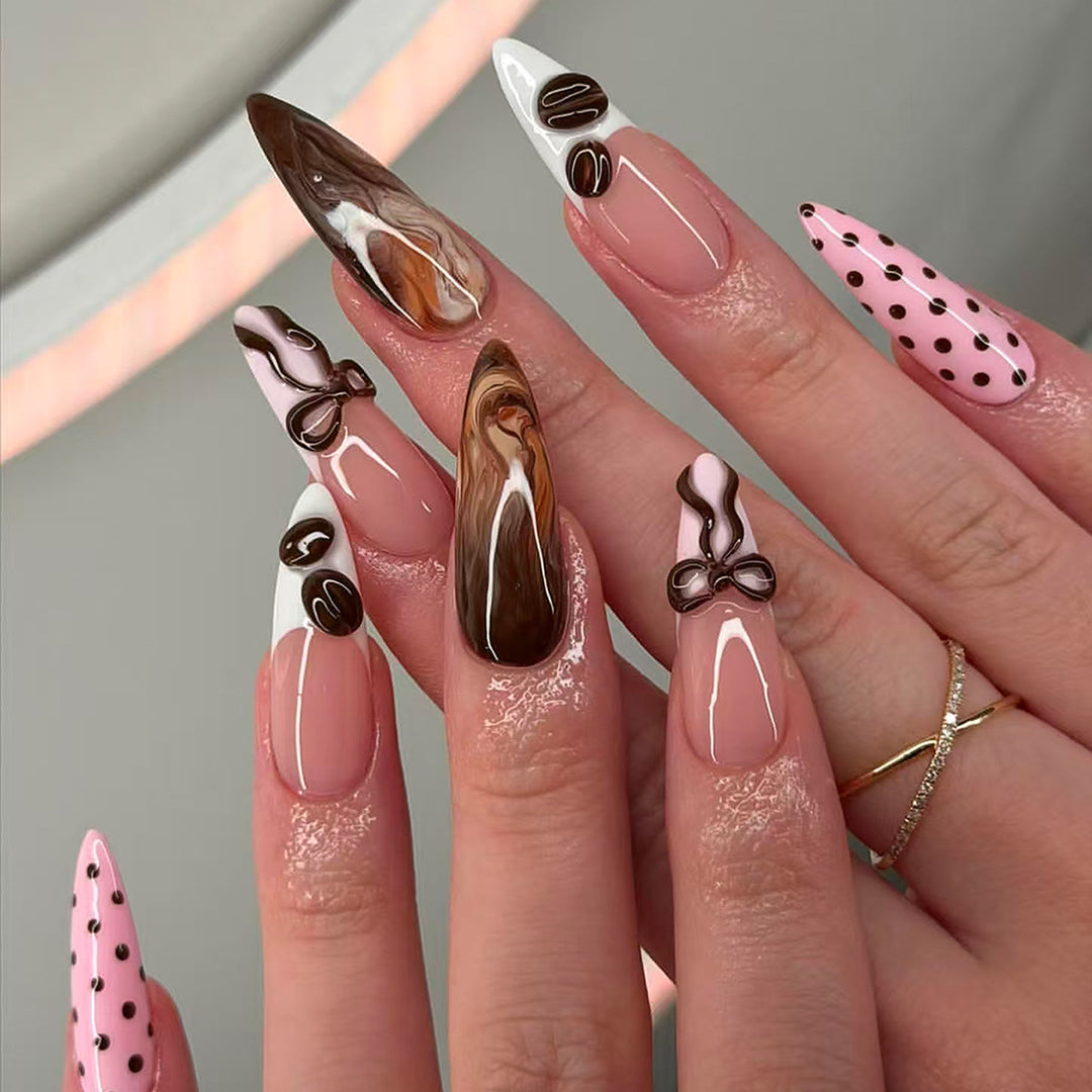Elegant artificial nails with chocolate motifs and 3D elements Bowlift