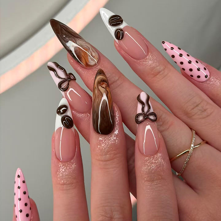 Elegant artificial nails with chocolate motifs and 3D elements Bowlift