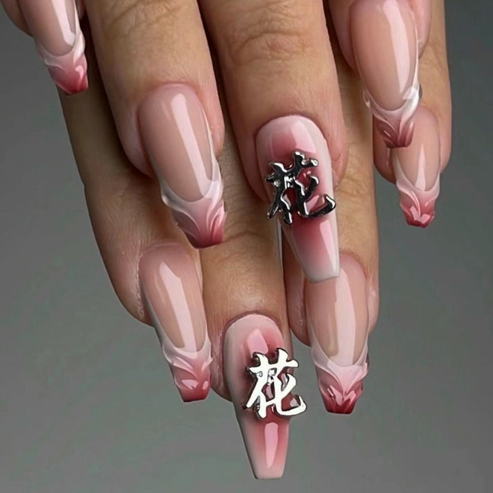 Artful stiletto nails with floral accents and 3D details Bowlift