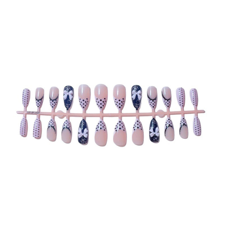 Elegant artificial nails with lace design and bow accents Bowlift