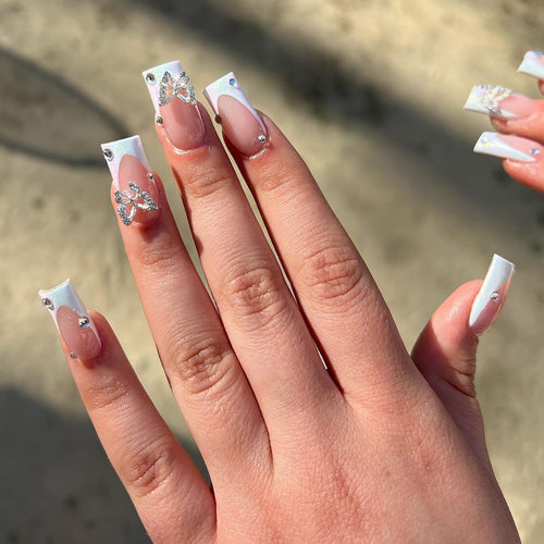 Elegant Nail Art with Glitter and Floral Accents Bowlift