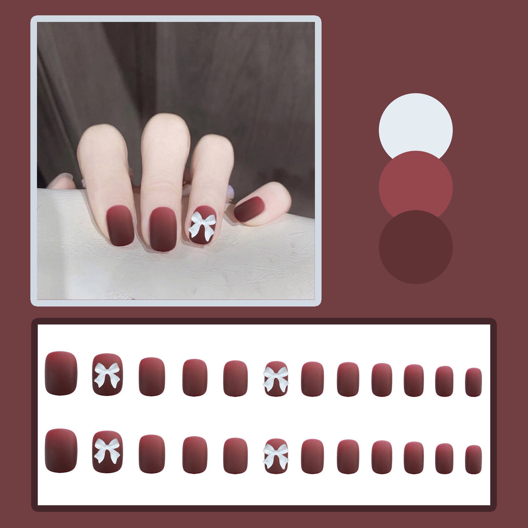 Artificial nails with elegant bow motifs Bowlift