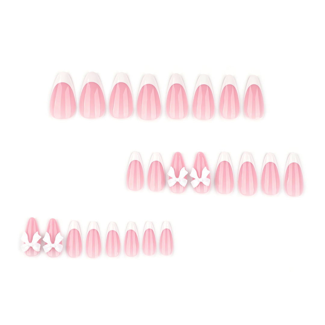 Artful nail designs with elegant tips and delicate bow motifs Bowlift