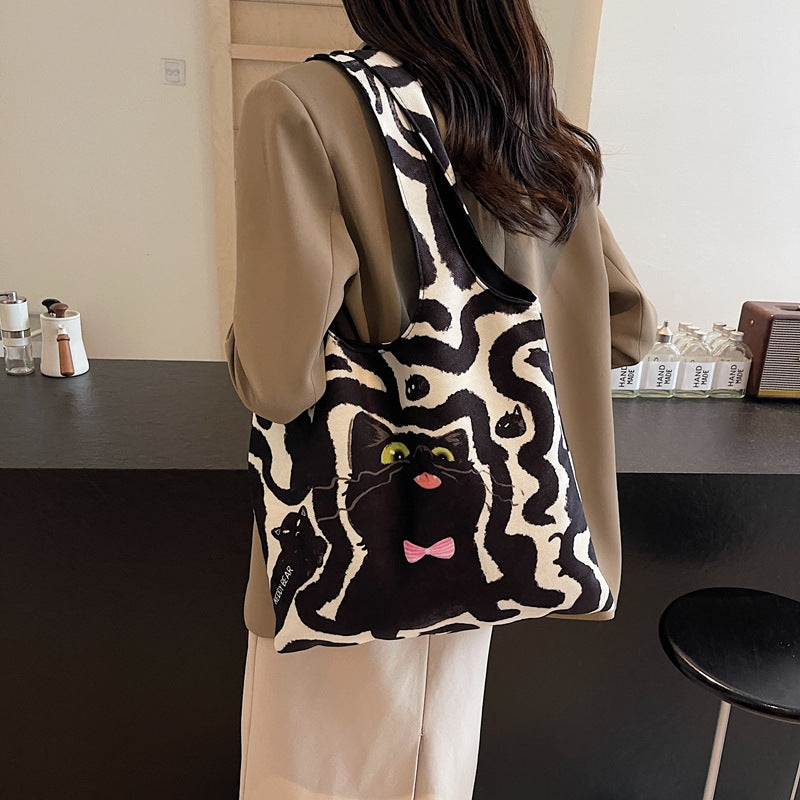 Shoulder bag with playful cat motif Bowlift