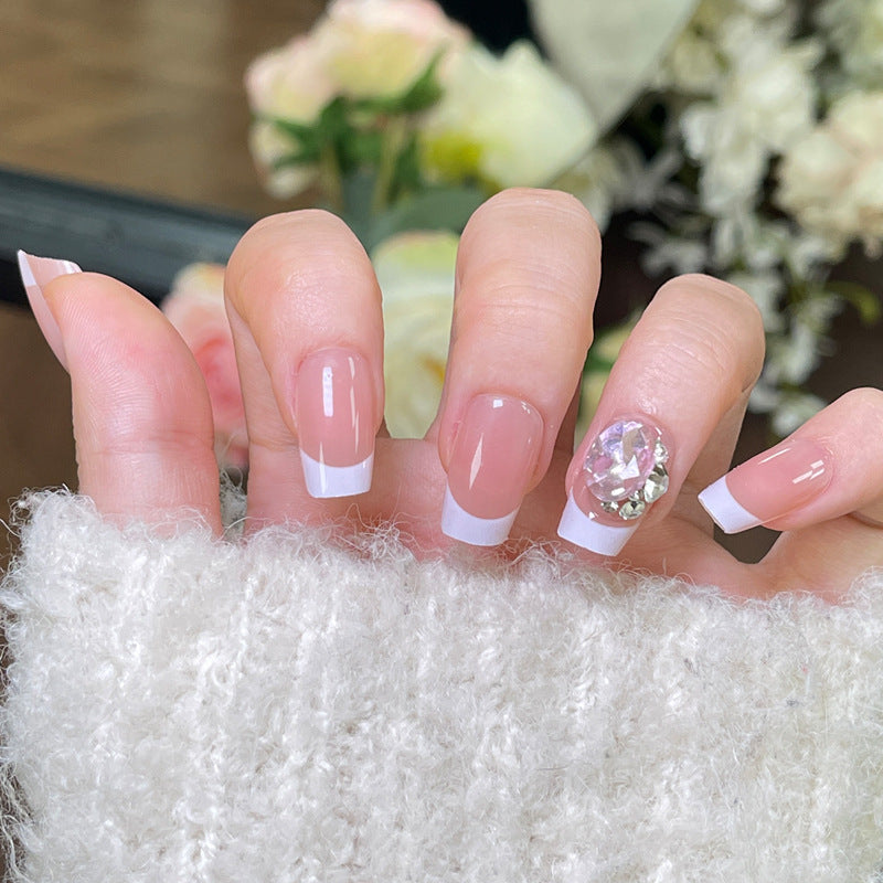 Elegant French Tip Press-On Nails with Decorative Rhinestone Accent Bowlift