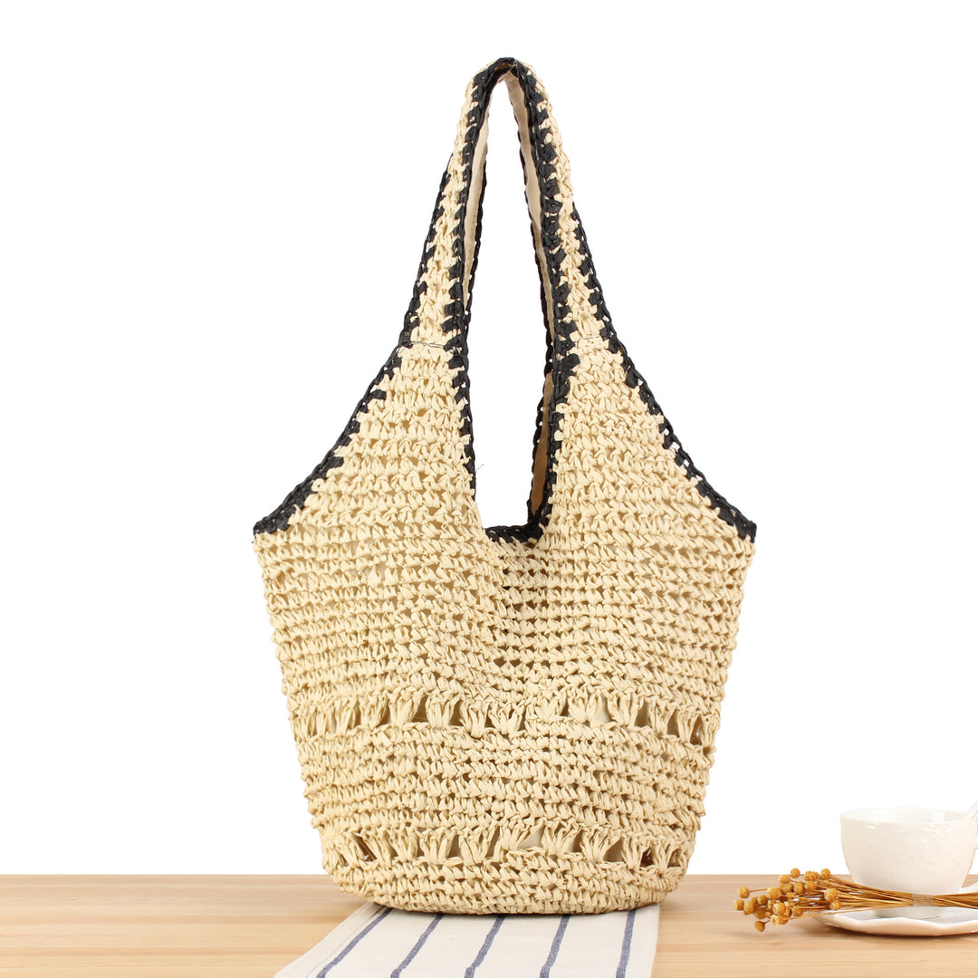 Beach shoulder bag made of handwoven natural material with comfortable carrying handles Bowlift