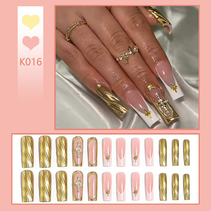 Acrylic nail set with elegant golden embellishments and glamorous accents Bowlift