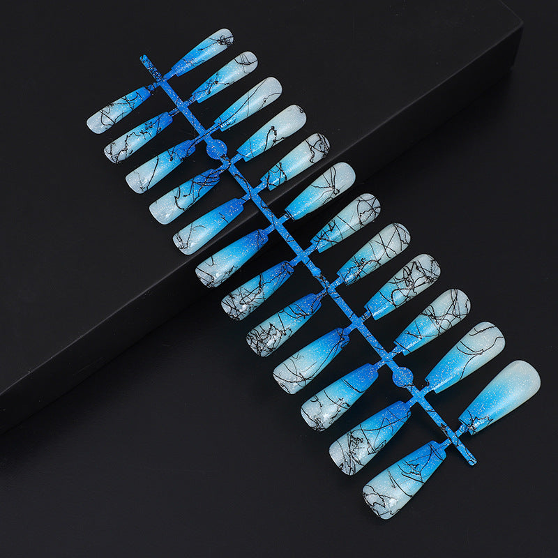 Artificial nails in modern ombre design with marbled accents Bowlift