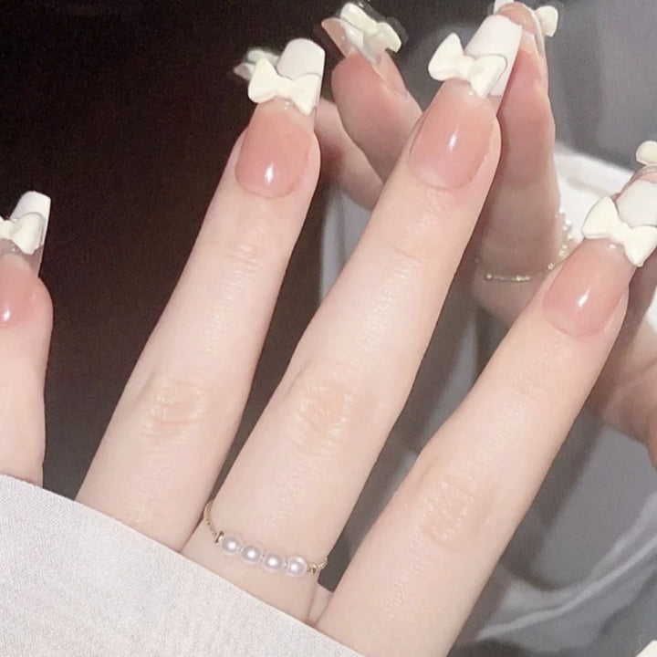 Elegant nail design with pearl embellishment Bowlift