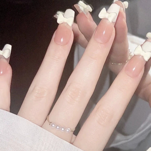 Elegant nail design with pearl embellishment Bowlift