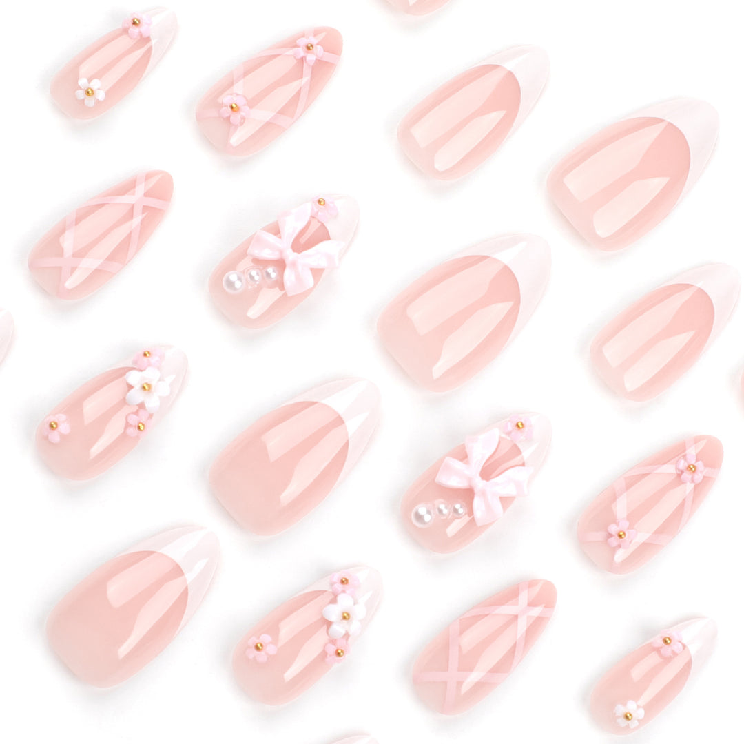 Artful nail art with delicate bows and floral accents Bowlift