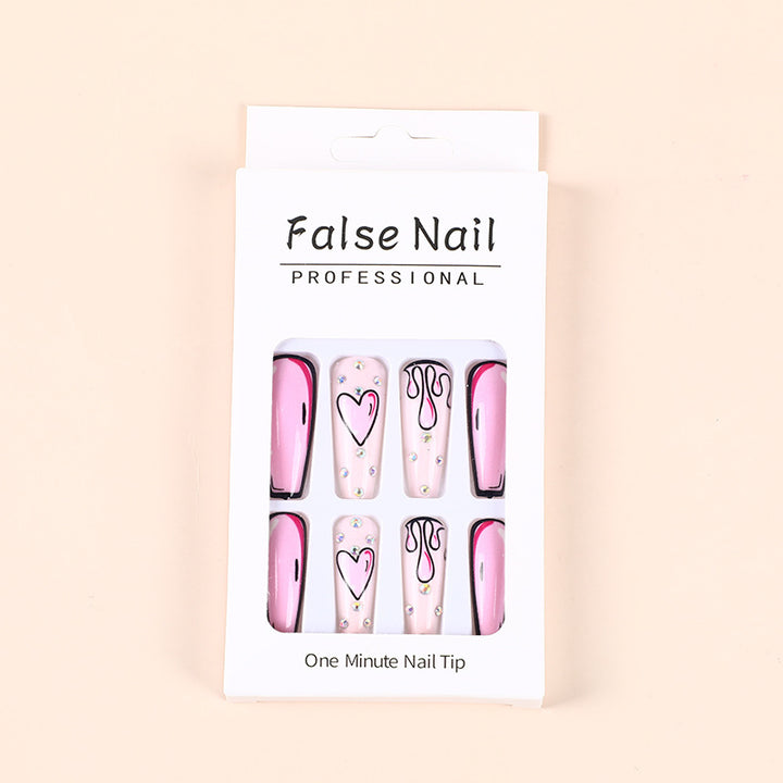 Eye-catching artificial nails with soulful heart design and glamorous accents Bowlift