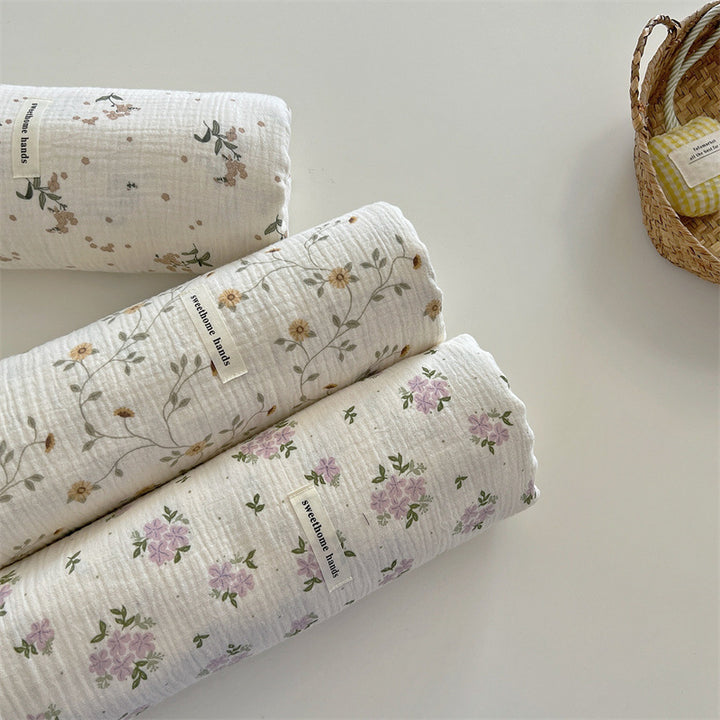 Unisex versatile muslin blanket with floral accents Bowlift