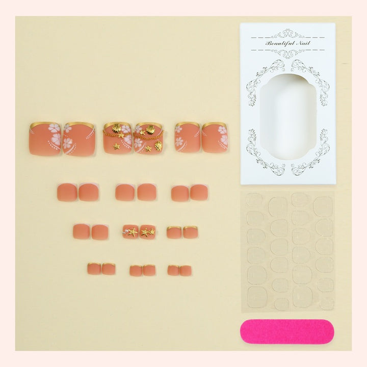 Artificial nail set with elegant, floral accents and golden decorations Bowlift