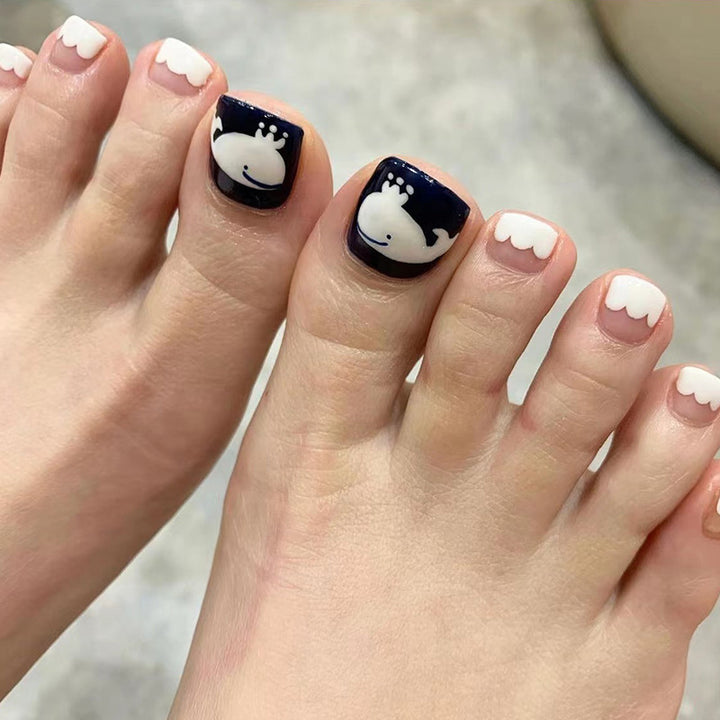 Artful toenail art with a moody whale motif Bowlift