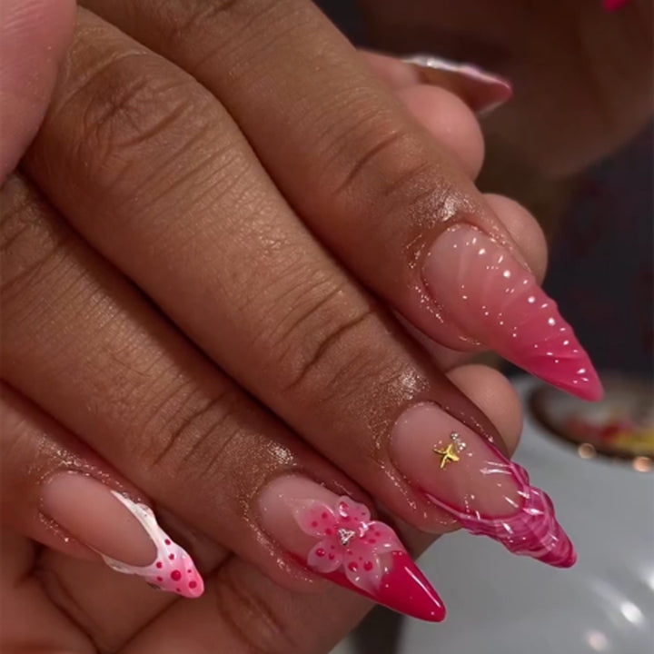 Artful stiletto nails with floral design and glitter accents Bowlift