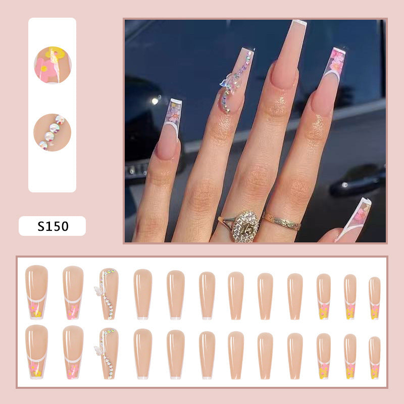 Artificail nail tips in elegant French design with floral accent Bowlift