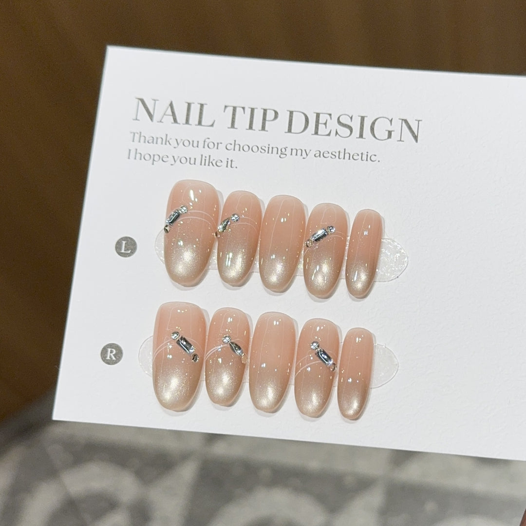Artificial nail tips with elegant gradient color and rhinestone accents Bowlift