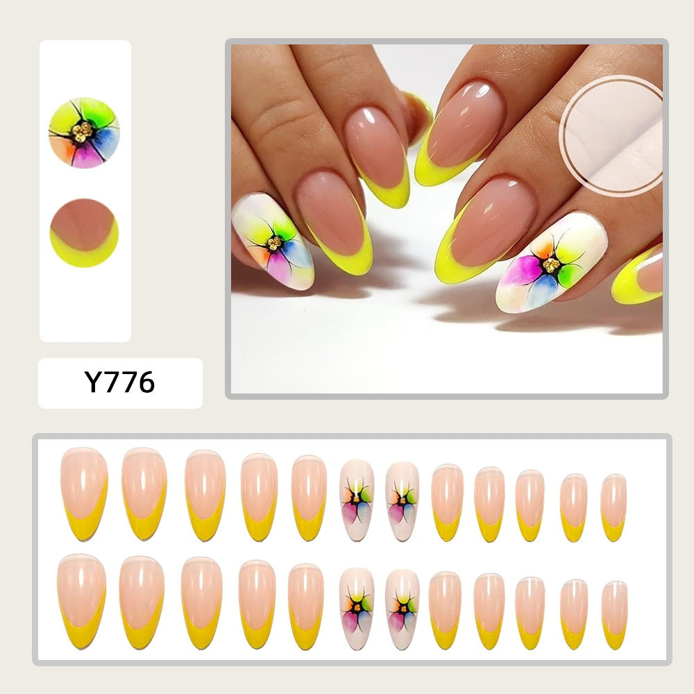 Artificial nails with colorful floral designs and striking color accents Bowlift
