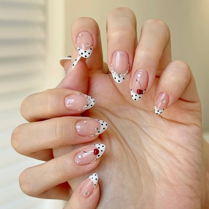 Acrylic nail set with polka-dotted accents and sparkling details Bowlift