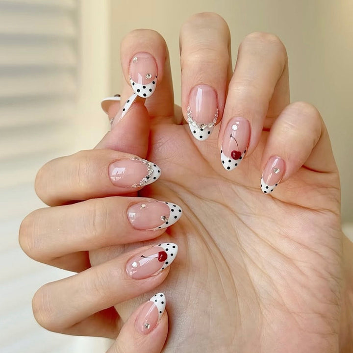 Acrylic nail set with polka-dotted accents and sparkling details Bowlift