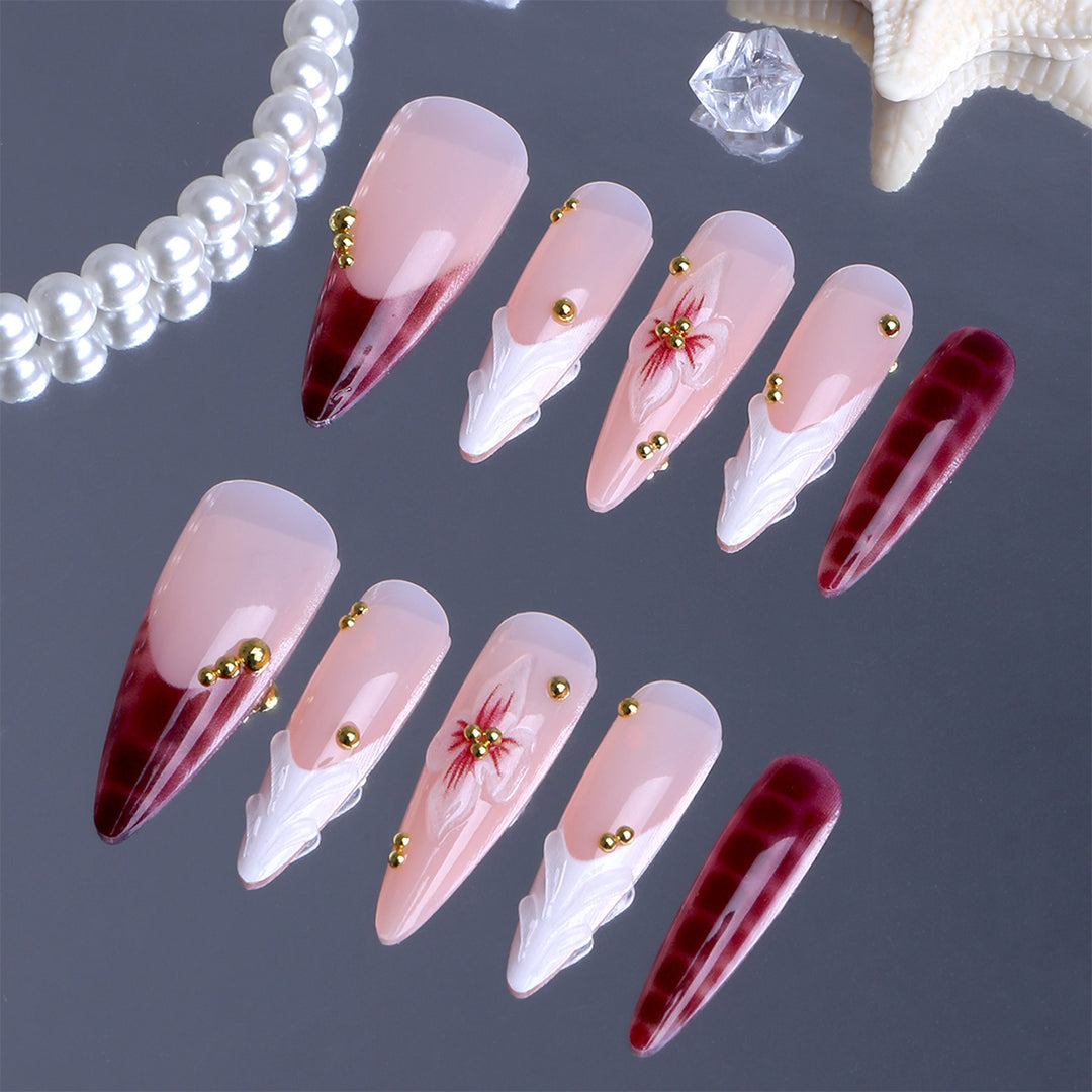 Artificial Nails in Elegant Modern Stiletto Style with Floral Design and Golden Accents Bowlift