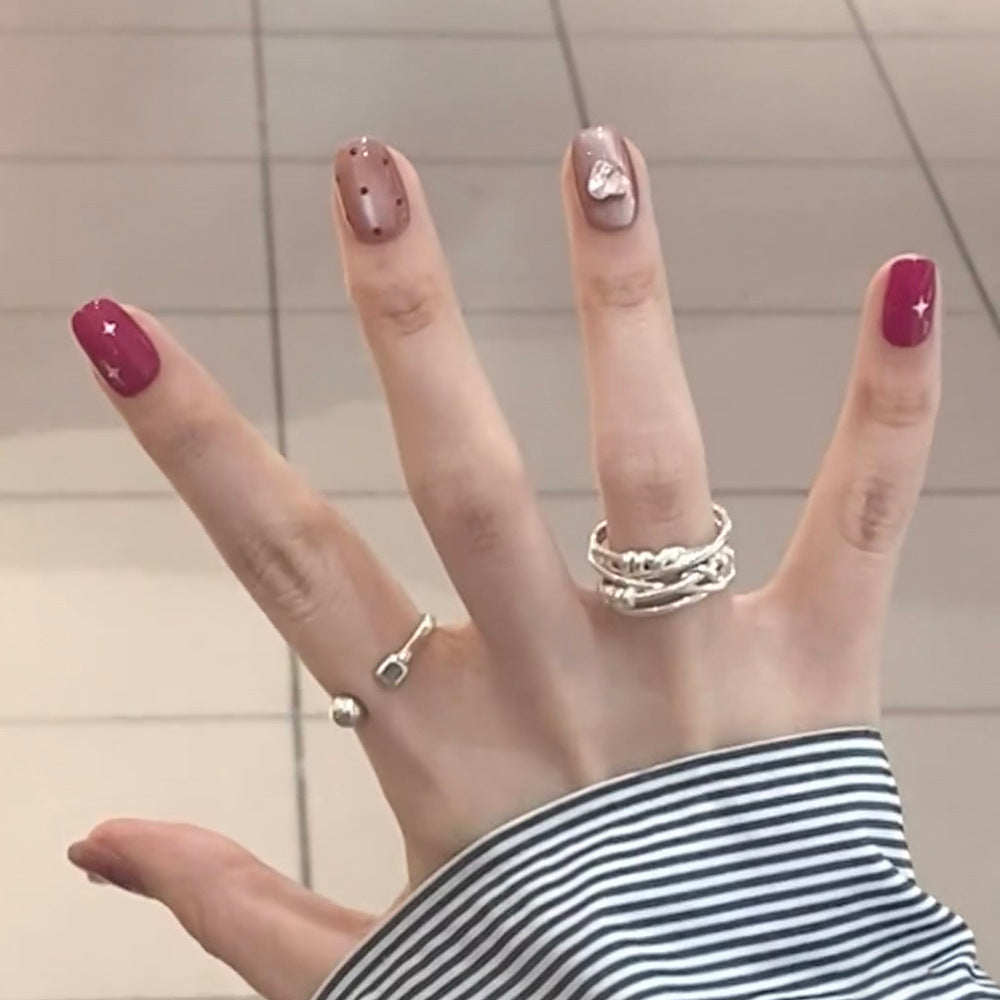 Artificial nail extensions with unique jewelry accents Bowlift