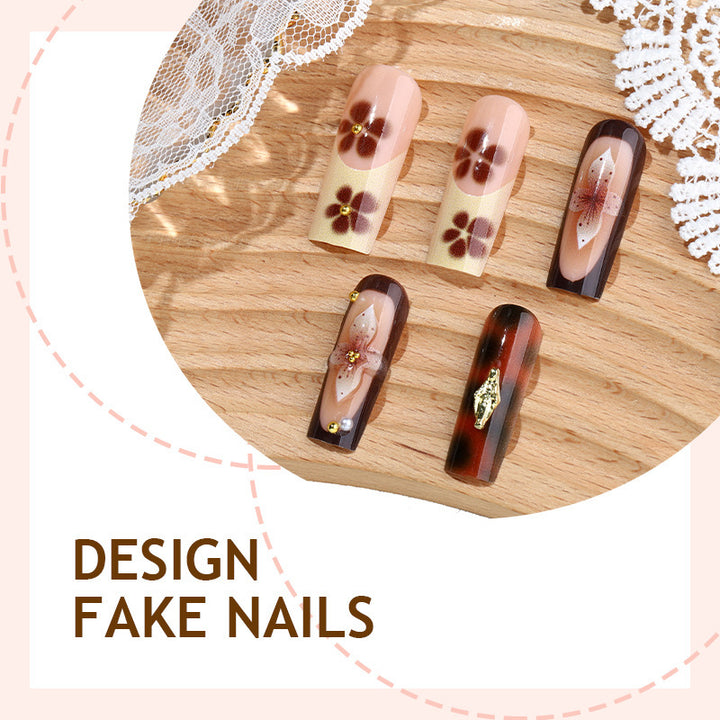 Nail set with floral accents and glitter accents Bowlift