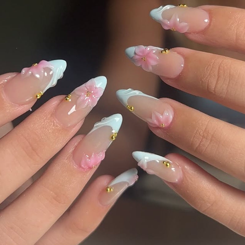 Creative nail art set with delicate flower design and glitter accents Bowlift