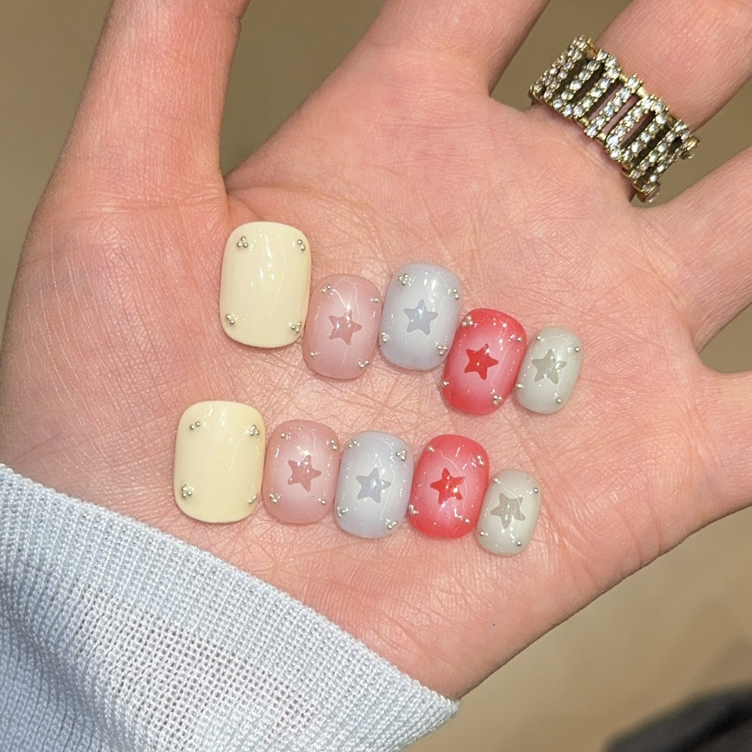 Artificial nails with sparkling star motifs Bowlift